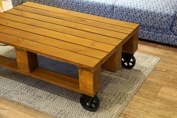 coffee table on wheels made from a wooden pallet.