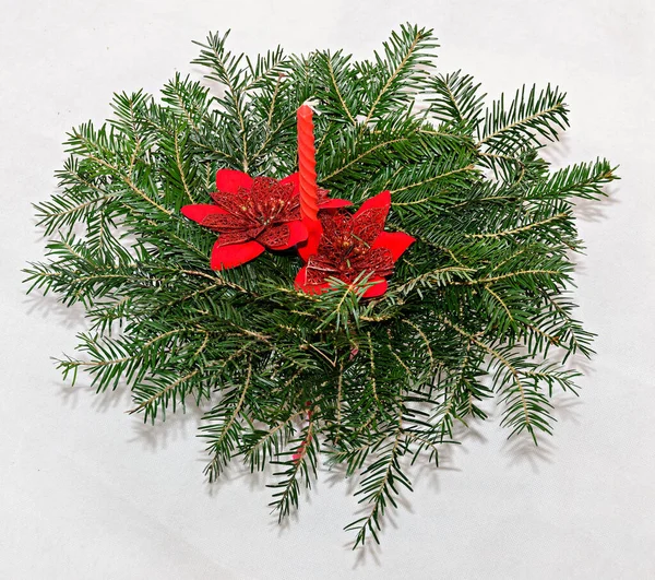 Fir tree christmas circle decoration with red candle