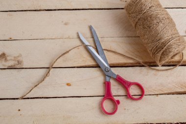 Vintage scissors on wooden background. Top view with place for text. clipart