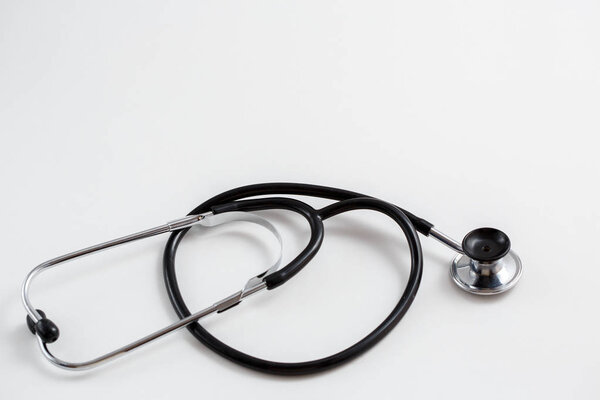 Concept for medicine. Vintage tonometer and stethoscope on white isolated background. View from above