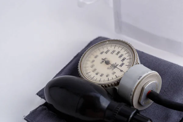 Concept for medicine. Vintage tonometer on white isolated background. View from above