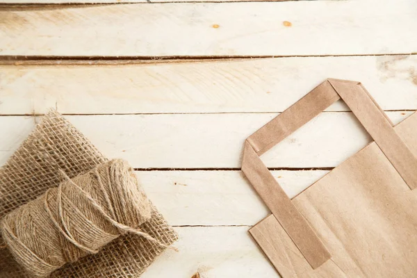 Cardboard bags on a wooden isolated background. Top view