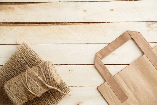 Cardboard bags on a wooden isolated background. Top view