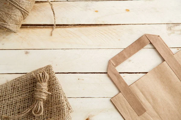 Cardboard bags on a wooden isolated background. Top view