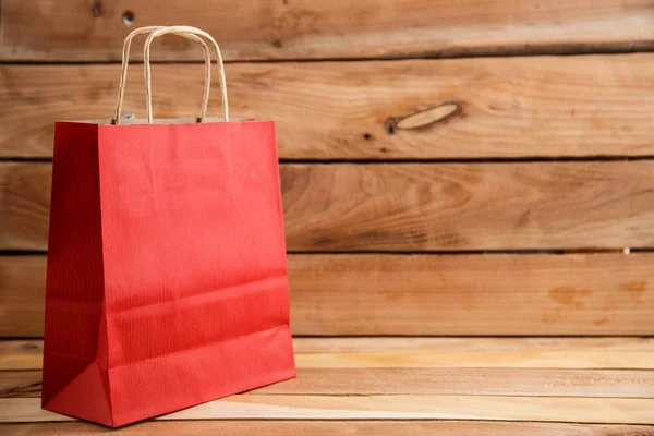 Cardboard bags on a wooden isolated background. Front view