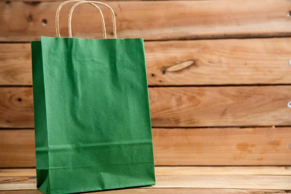 Cardboard bags on a wooden isolated background. Front view