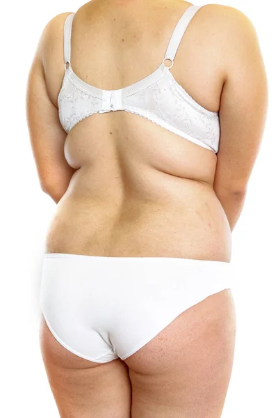 Mujer gorda joven en lencería sobre fondo blanco aislado. lado v — Foto de Stock
