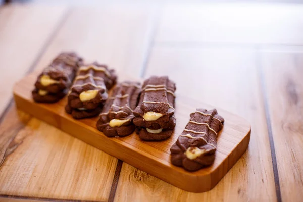 shortbread cookies on wooden stand on wooden background. the view from the top