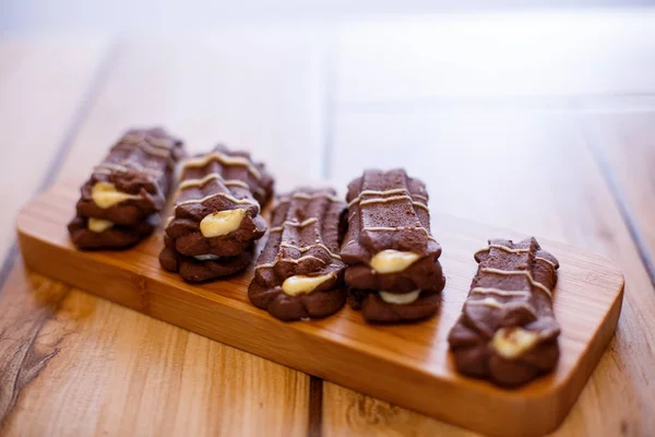 shortbread cookies on wooden stand on wooden background. the view from the top