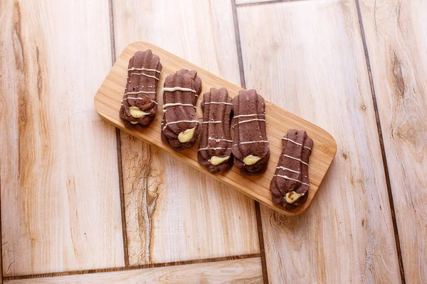 shortbread cookies on wooden stand on wooden background. the view from the top