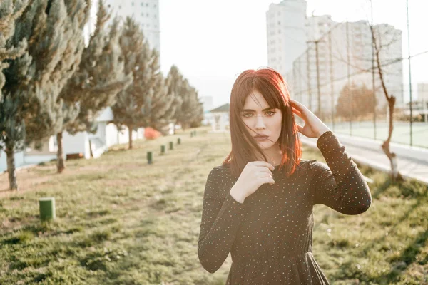 Young beautiful girl with heavy and sullen look in black dress o — 스톡 사진