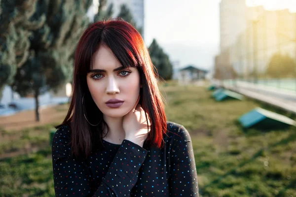 Young beautiful girl with heavy and sullen look in black dress o — ストック写真