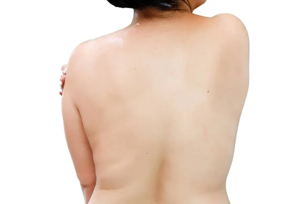 Mulher de roupa interior branca aplicando creme no pescoço e ombros — Fotografia de Stock