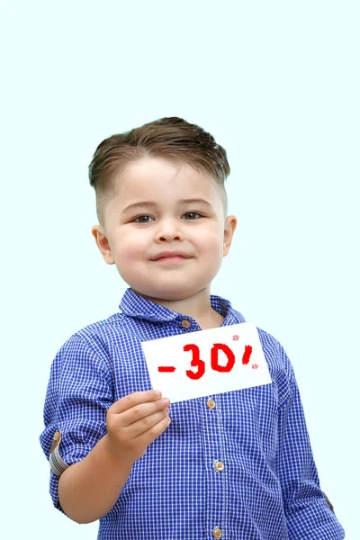 The boy holds a sign with a percentage of discounts — Stock Photo, Image