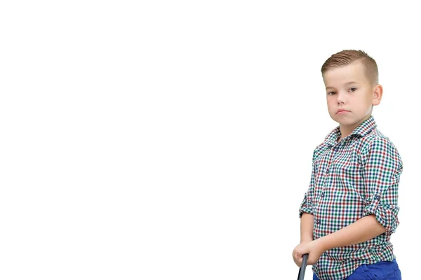 Caucasian boy standing on a white isolated background and holdin — Stock Photo, Image
