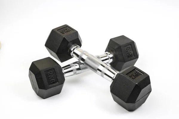 Sports dumbbells with black rubber handle on white isolated back — Stock Photo, Image