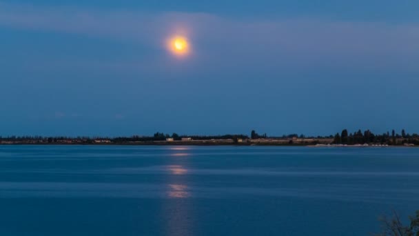 Sunset of the bloody moon on the seacoast — Stock Video