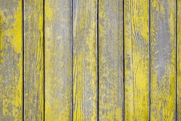 Ahşap arka plan aşınmış sarı boya ile