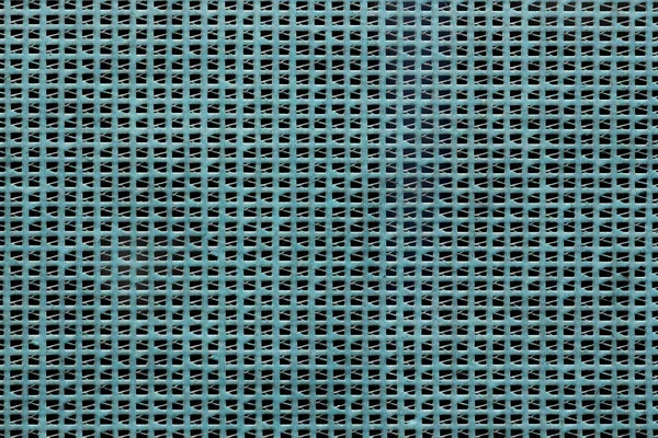 Construction protective mesh against dust and debris. Turquoise background