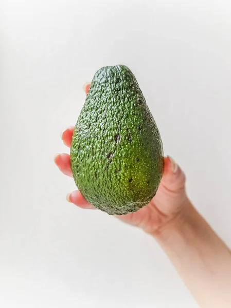 Ripe Avocado Hand White Bakcground Side View — Stock Photo, Image