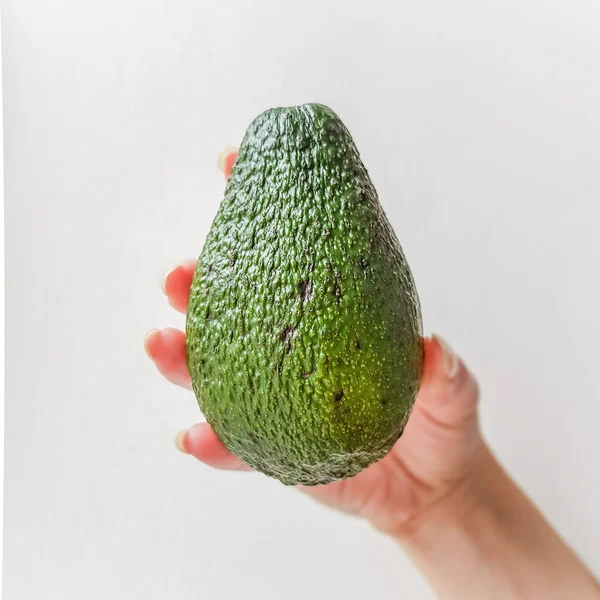 Ripe Avocado Hand White Bakcground Side View — Stock Photo, Image