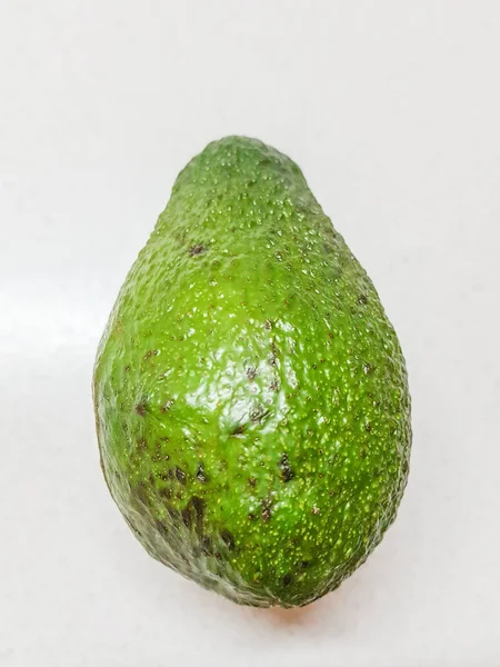Ripe Avocado Hand White Bakcground Side View — Stock Photo, Image