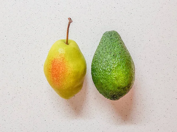 Ripe Yellow Pear Avocado White Marble Table Top View — Stock Photo, Image