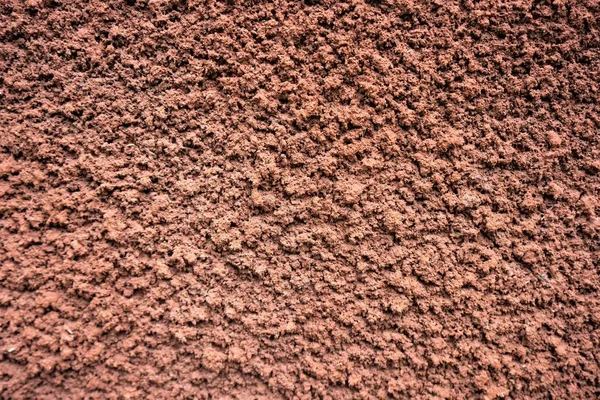Sfondo marrone intonaco decorativo ragged ruvido convesso — Foto Stock