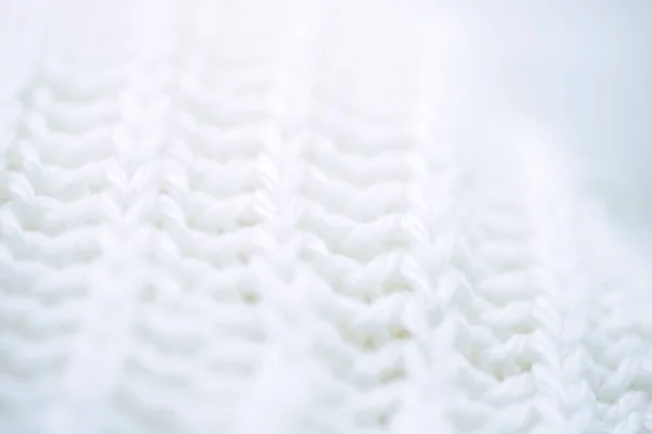 Фон з білою шерстю в'язаний текстиль, макро постріл . — стокове фото