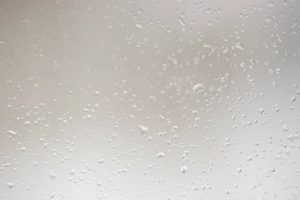 Bakgrund med makro vatten droppar på glas — Stockfoto