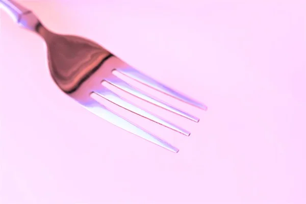 One silver fork in pink tone — Stock Photo, Image