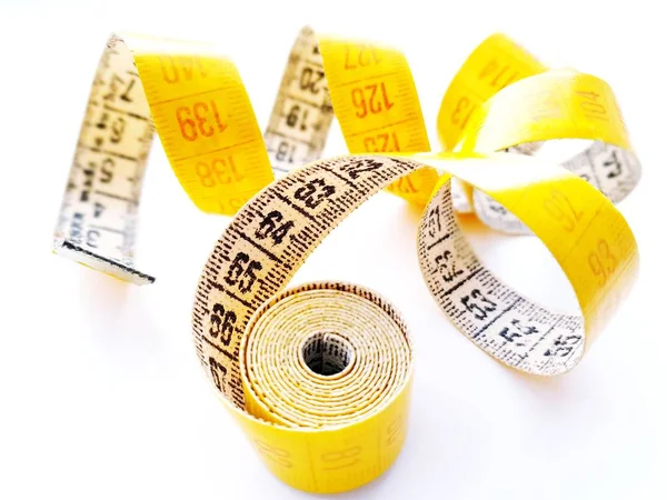 Yellow measuring tape isolated on white background — Stock Photo, Image