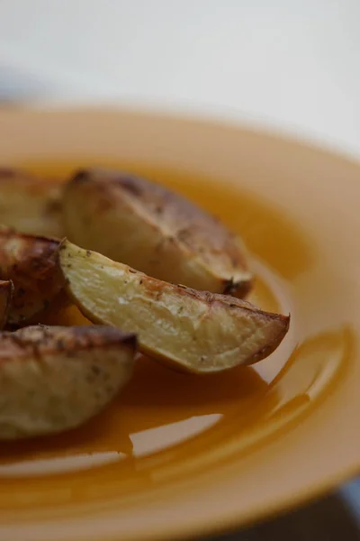 ready baked potatoes in a plate closeup