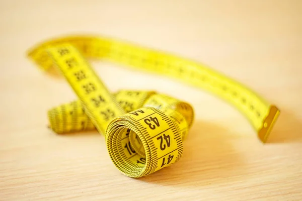 Yellow Measuring Tape Wooden Table — Stock Photo, Image