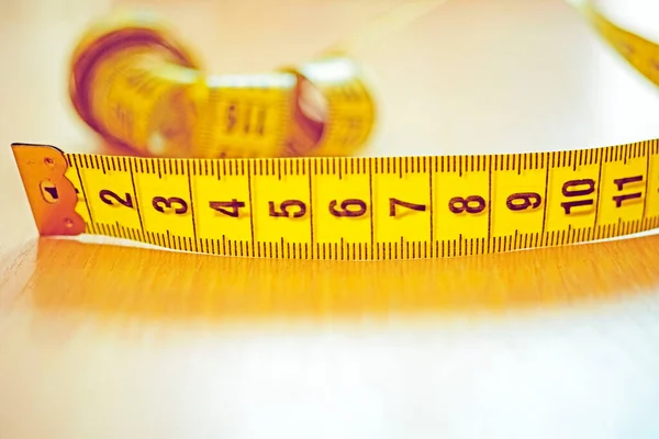 Yellow Measuring Tape Black Scale Wooden Table Copy Space Side — Stock Photo, Image