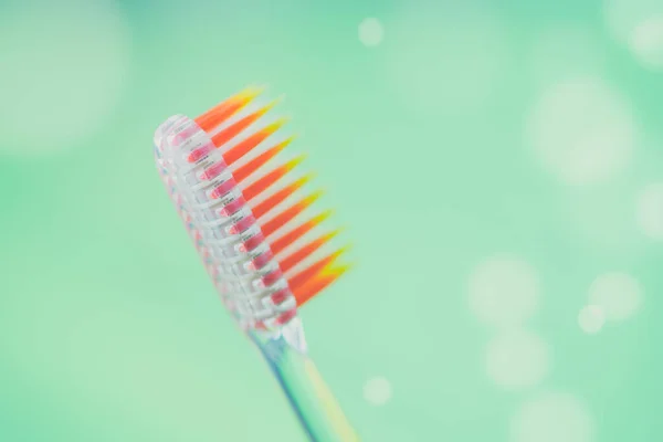 New Plastic Toothbrush Green Background Bubbles — Stock Photo, Image