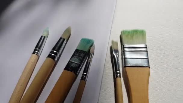 Used Brushes Painting White Textured Paper — Stock Video