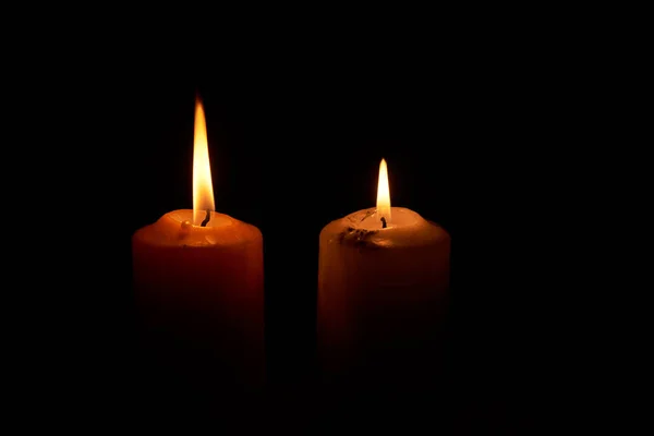 Two candlelights in the dark backgroud