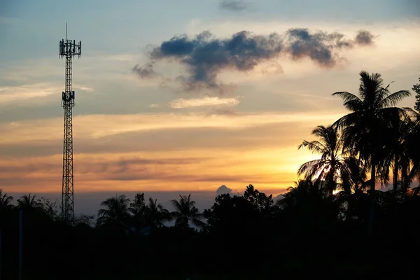 Telephone antenna on sunset sky background — Stock Photo, Image