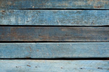 Düğümlü ve çivi delikli eski mavi eski bir ahşap arka plan