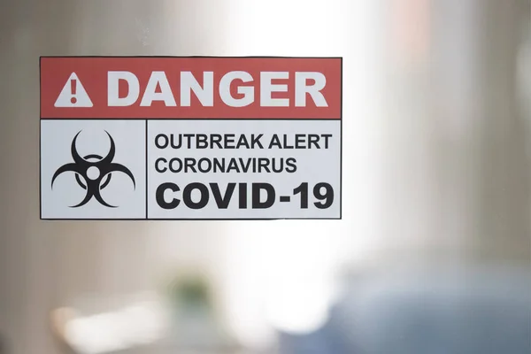 Corona Virus or Covid-19 Warning Signage on the Hospital Mirror Door