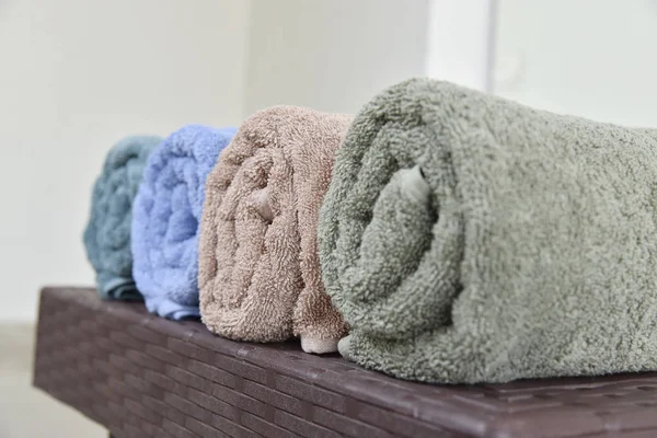 SOFT COTTON TOWEL OVER THE TABLE. HOTEL TOWEL ISOLATED. SPA TOWEL COLLECTION.