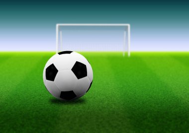 Futbol ya da futbol topu ve çim alan resimde kalede.