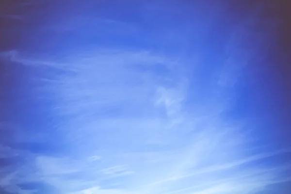 Peaceful blue sky with white clouds landscape filtered.