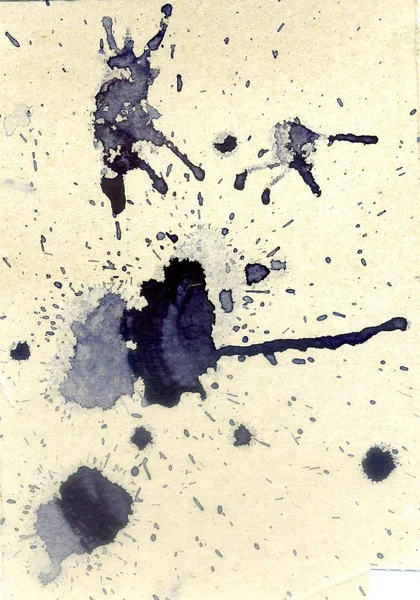 Abstract grunge ink blob on textured paper background.