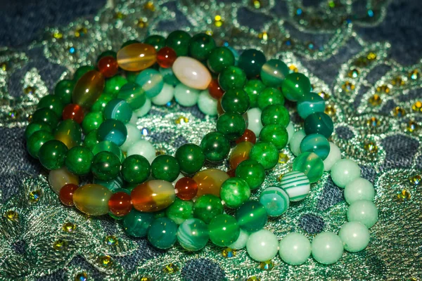 Boho beaded bracelets with green agate and onyx stones.
