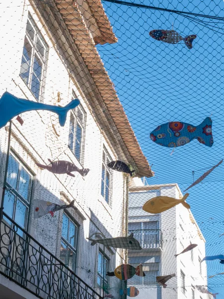 Street decoration of nets with fishes in the Portuguese village of Aveiro