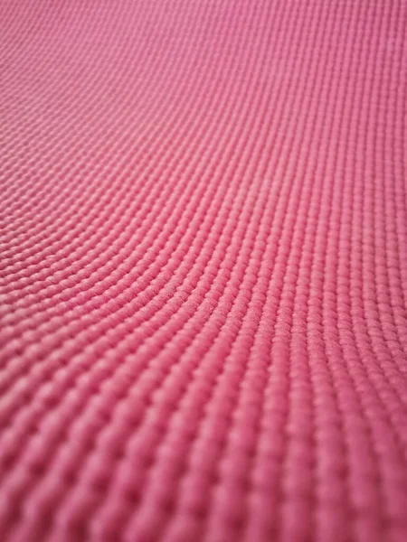 Close up of pink yoga mat