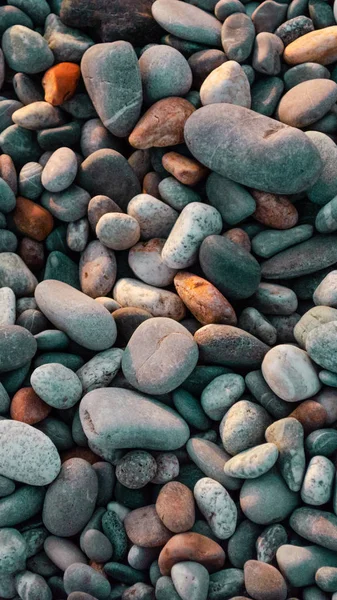 Abstrakter Hintergrund aus mehrfarbigen Steinen — Stockfoto