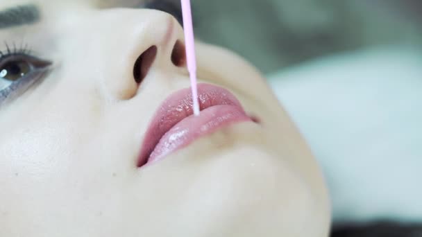 Applying Red Permanent Make Tattoo Young Girl Lips Close Plastic — Stock Video